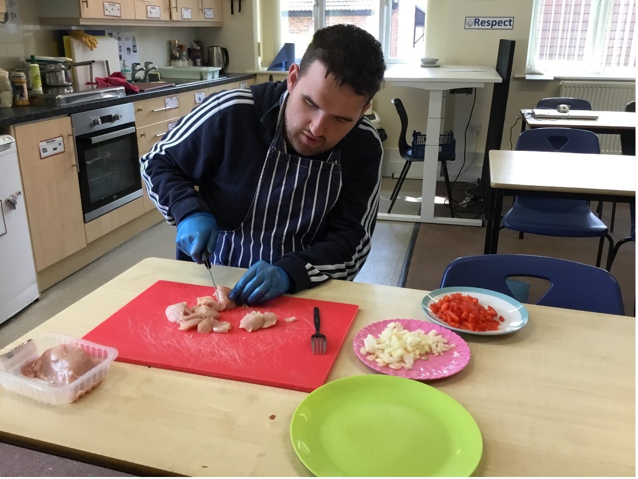 Chris making lunch for himself and the staff at college showing his Employability